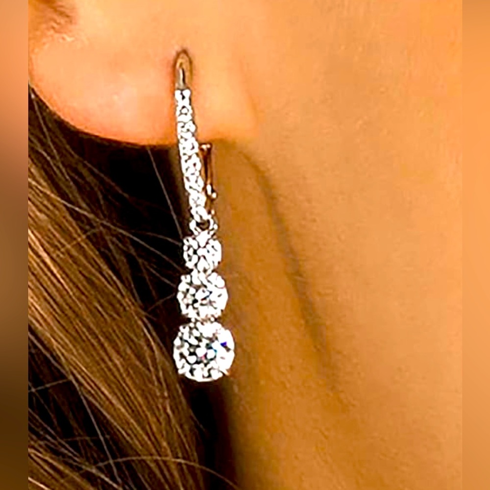 Swarovski dangling earrings eye catching style.of Swarovski brilliance.